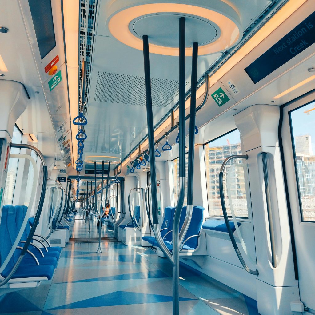 Clean, modern Dubai Metro train at a station – affordable transport for budget travel tips Dubai seekers.