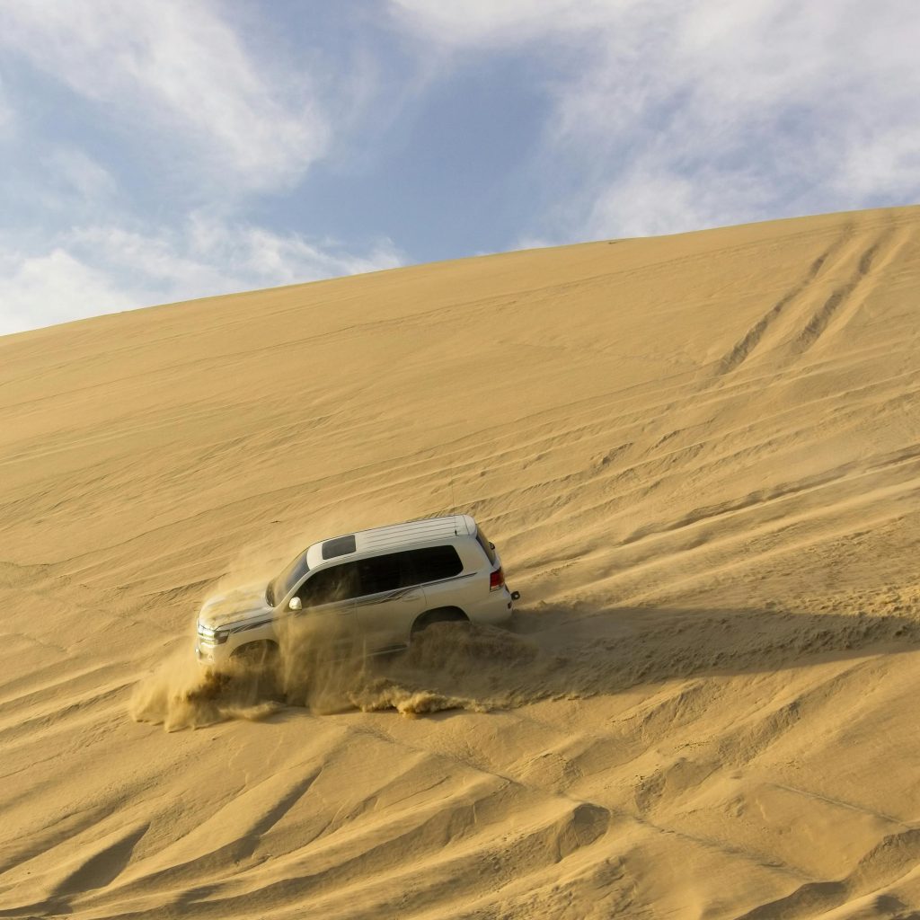 Tourists enjoying a thrilling desert safari, one of the Top 7 Must-See Attractions in Dubai for adventure seekers.