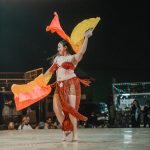 Belly dance performance under the stars during a desert safari experience by one of the best tourism companies in Dubai