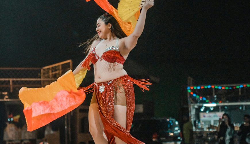 Belly dance performance under the stars during a desert safari experience by one of the best tourism companies in Dubai